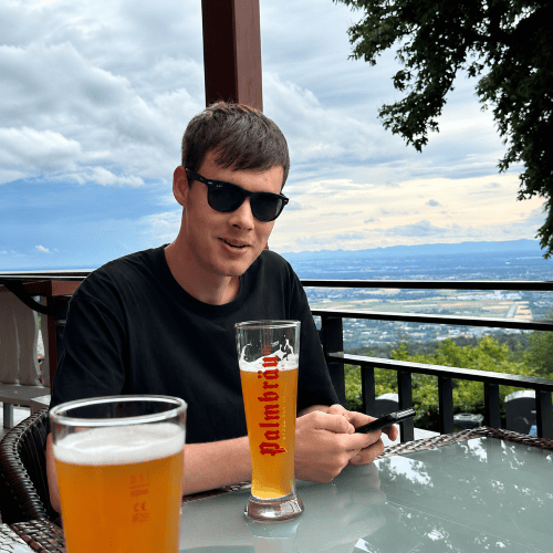 Man in sunglasses having a beer